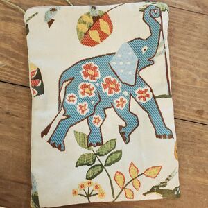 unbranded woven textile pouch featuring a blue elephant motif and floral pattern